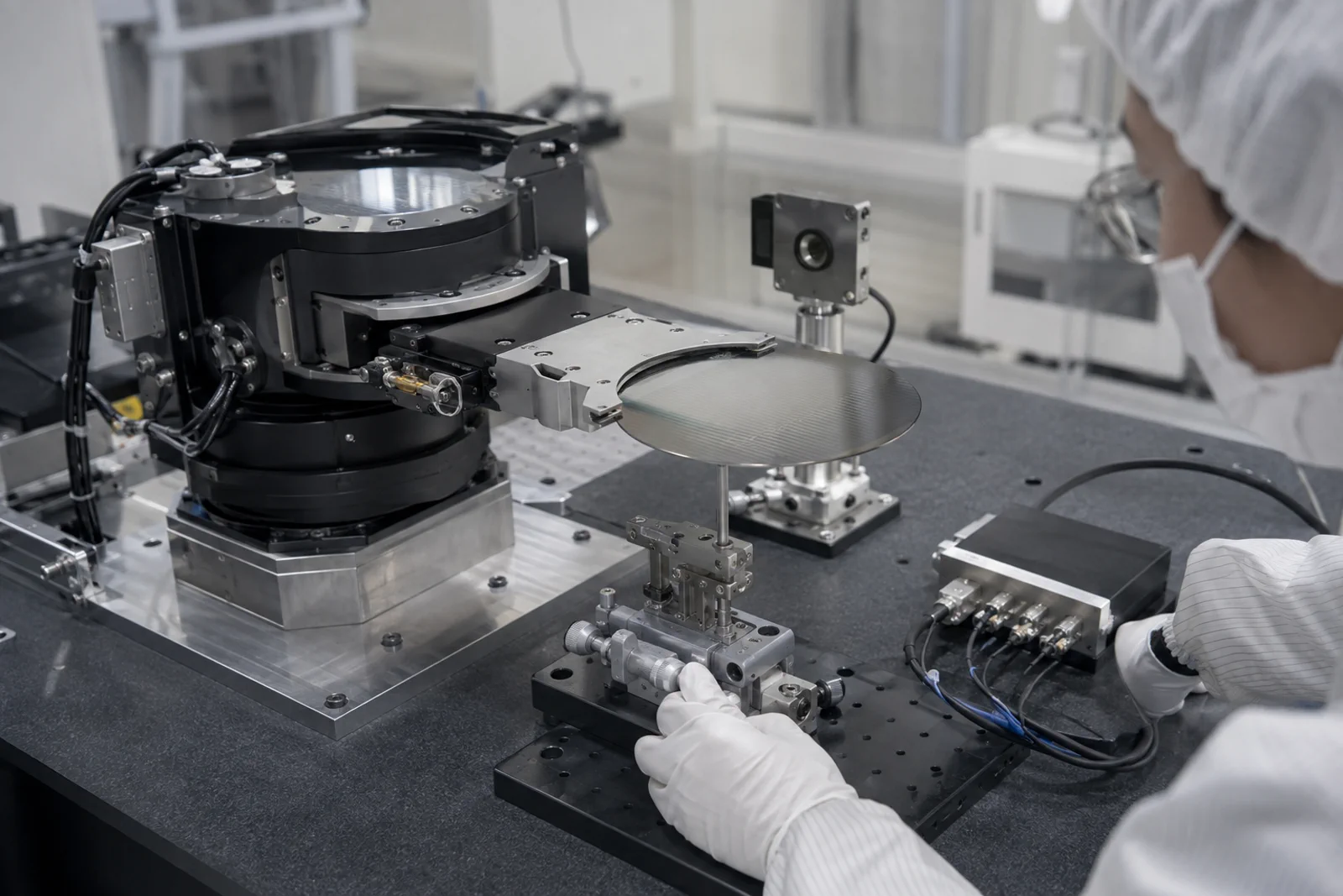 Engineer validating a rotary encoder and wafer-handler end-effector position with an independent reference